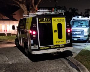 plumbing company work truck on site at clients house 